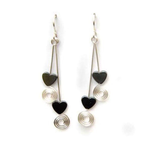 Double drop hematite heart earrings with coils, on sterling silver earwires.